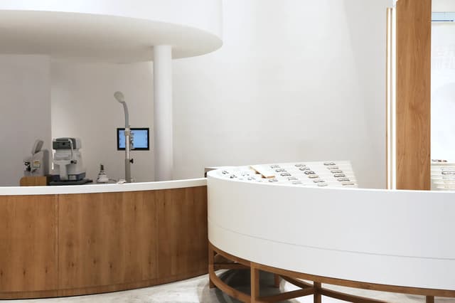A clinic front desk, empty and calm in daylight